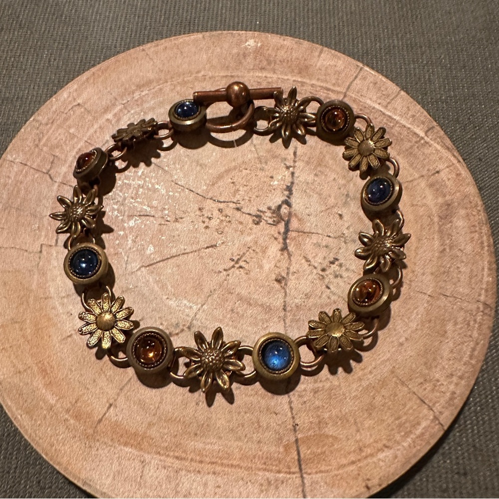 Elegant copper colored Floral Bracelet with Blue and Brown Accents